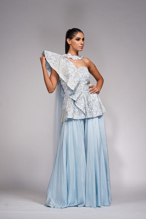 A model showcasing White Embroidery Peplum Sharara by Shruti S Label from Shruti S Label's collection