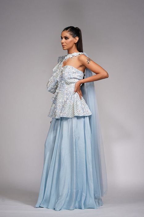 A model showcasing White Embroidery Peplum Sharara by Shruti S Label from Shruti S Label's collection