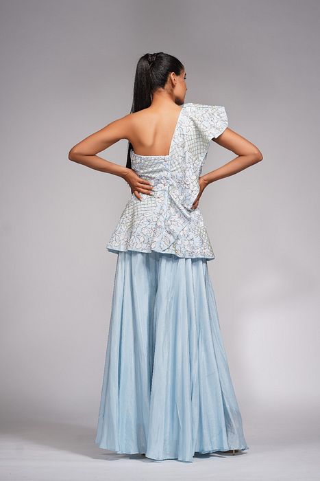 A model showcasing White Embroidery Peplum Sharara by Shruti S Label from Shruti S Label's collection