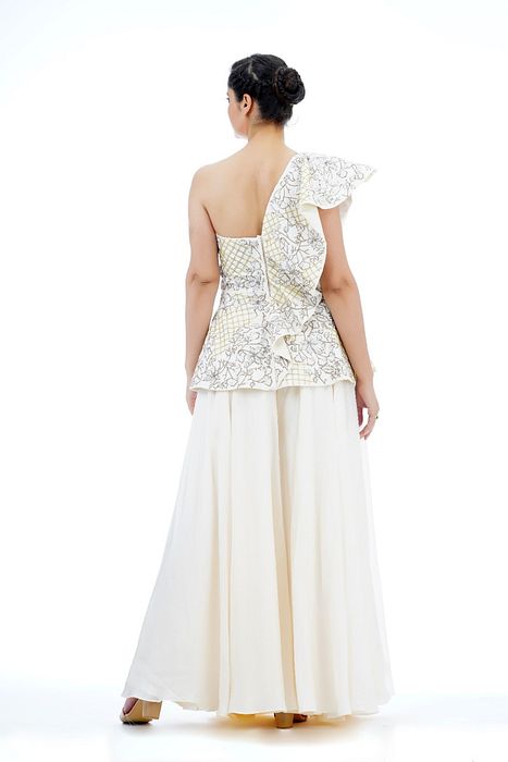 A model showcasing White Embroidery Peplum Sharara Set by Shruti S Label from Shruti S Label's collection