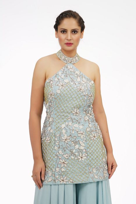 A model showcasing Ice Blue Halter Neck Sharara Set by Shruti S Label from Shruti S Label's collection