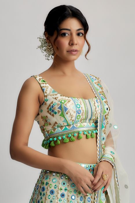 A model showcasing Ivory Vidhi Lehenga by Gopi Vaid from Gopi Vaid's collection