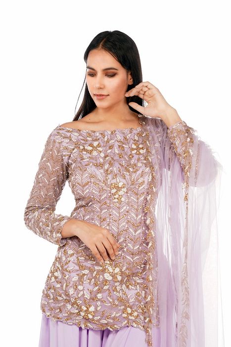 A model showcasing Bateau Neck Lavender Sharara Set by Shruti S Label from Shruti S Label's collection