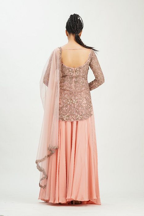 A model showcasing Bateau Neck Peach Gold Sharara by Shruti S Label from Shruti S Label's collection
