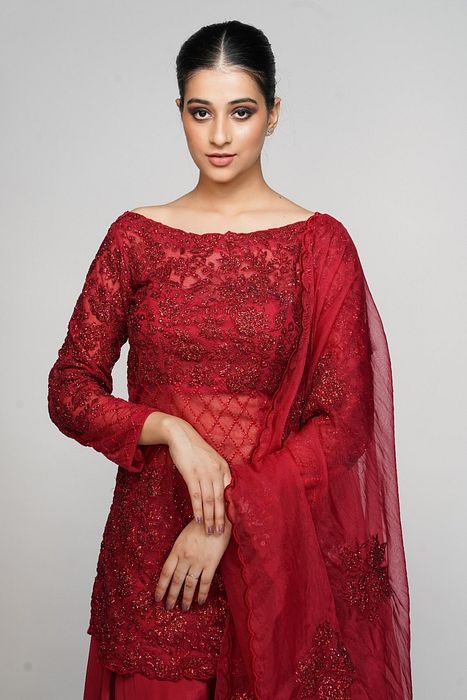 A model showcasing Red Cocktail Sharara by Shruti S Label from Shruti S Label's collection