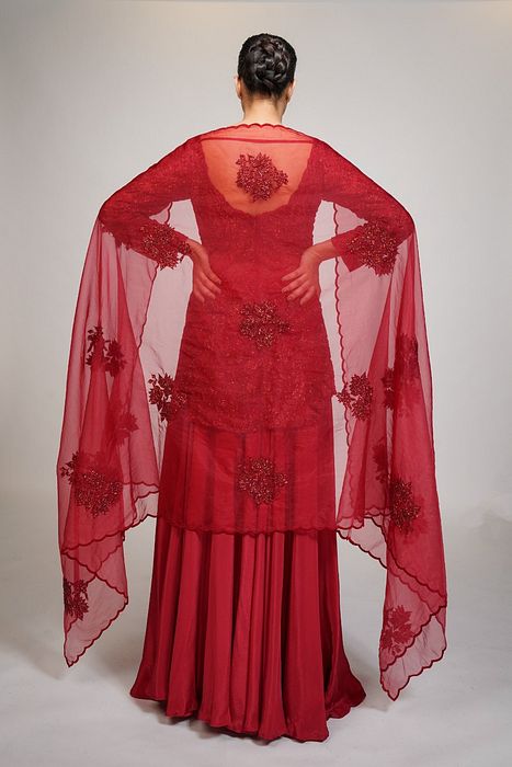 A model showcasing Red Cocktail Sharara by Shruti S Label from Shruti S Label's collection