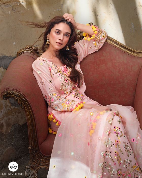 A model showcasing Pink Friya Short Kurta Sharara Set by Gopi Vaid from Gopi Vaid's collection