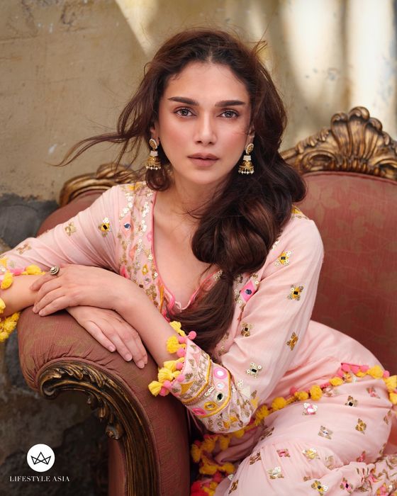 A model showcasing Pink Friya Short Kurta Sharara Set by Gopi Vaid from Gopi Vaid's collection