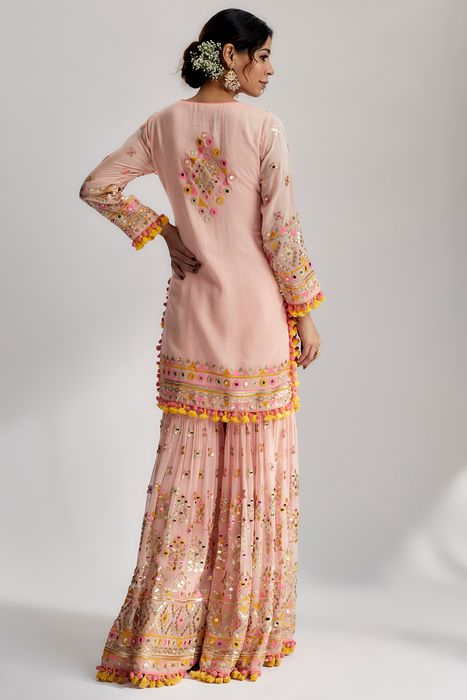 A model showcasing Pink Friya Short Kurta Sharara Set by Gopi Vaid from Gopi Vaid's collection
