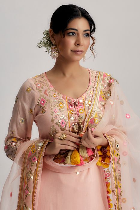A model showcasing Pink Friya Short Kurta Sharara Set by Gopi Vaid from Gopi Vaid's collection