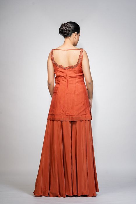 A model showcasing Burnt Orange Gharara Set by Shruti S Label from Shruti S Label's collection