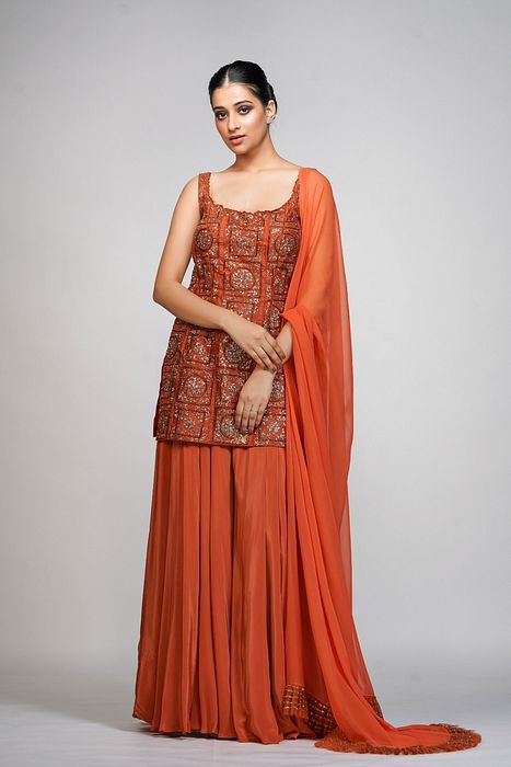 A model showcasing Burnt Orange Gharara Set by Shruti S Label from Shruti S Label's collection