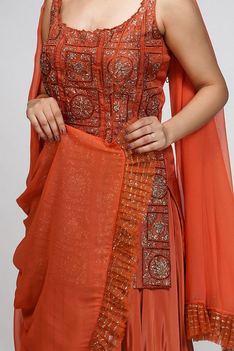 A model showcasing Burnt Orange Gharara Set by Shruti S Label from Shruti S Label's collection