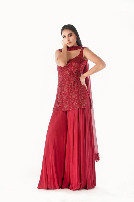 A model showcasing Lal Gharara by Shruti S Label from Shruti S Label's collection A model showcasing Lal Gharara by Shruti S Label from Shruti S Label's collection