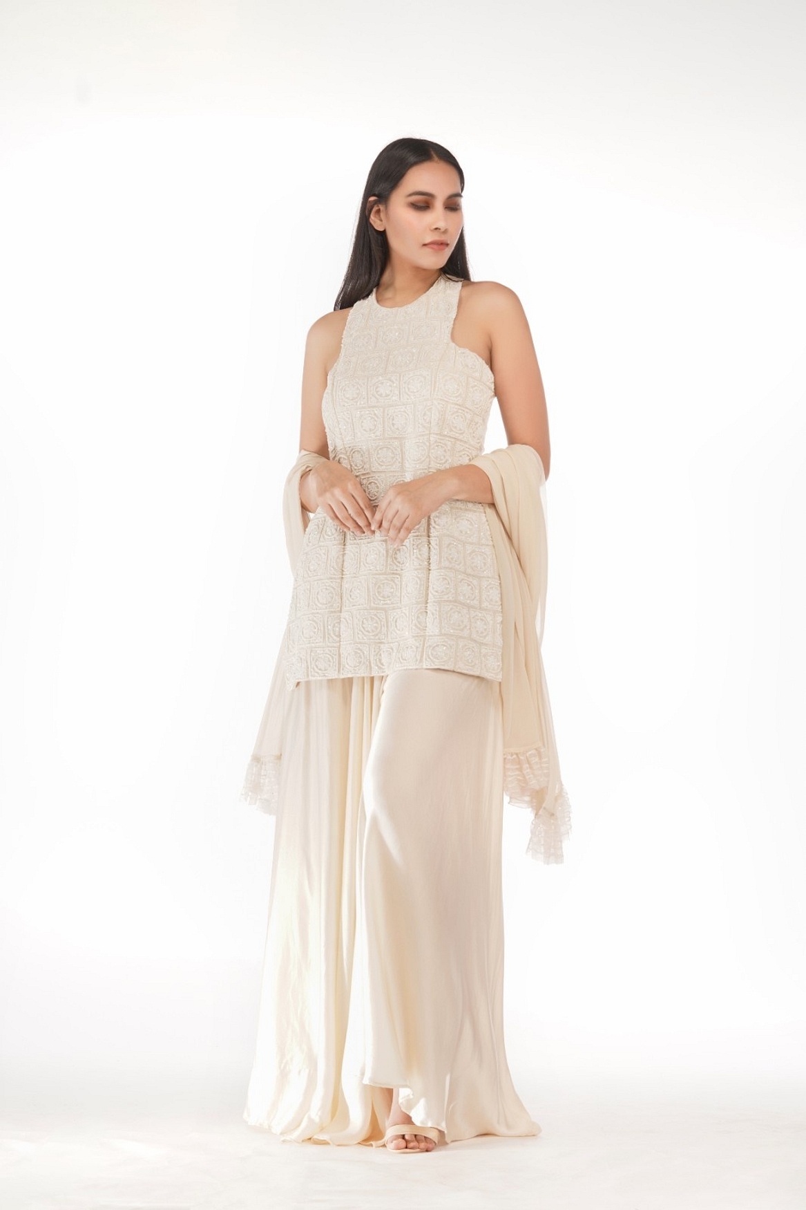 A model showcasing Off White Racer Cut Sharara Suit Feature image by Shruti S Label from Shruti S Label's collection