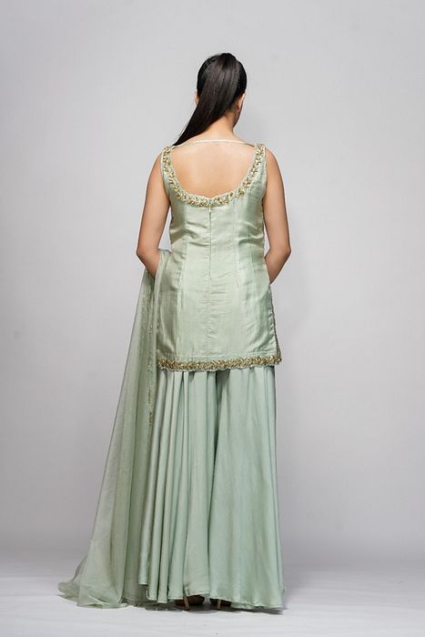 A model showcasing Silver Gold Sharara Set by Shruti S Label from Shruti S Label's collection