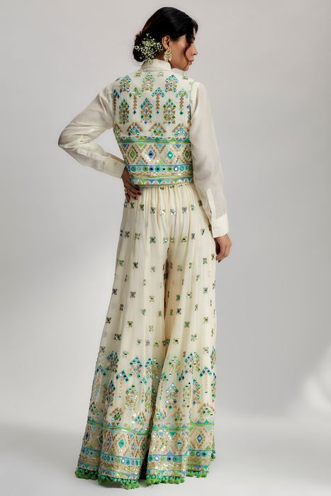 A model showcasing Amara Jacket Set With Flared Pants In Ivory by Gopi Vaid from Gopi Vaid's collection