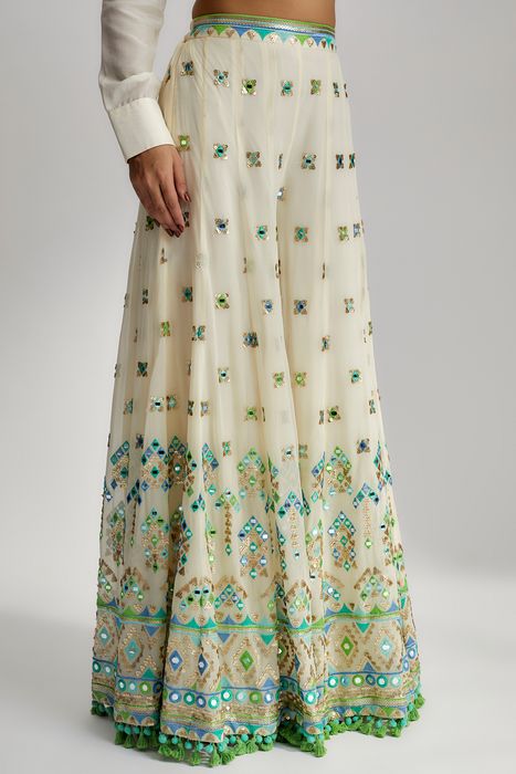 A model showcasing Amara Jacket Set With Flared Pants In Ivory by Gopi Vaid from Gopi Vaid's collection