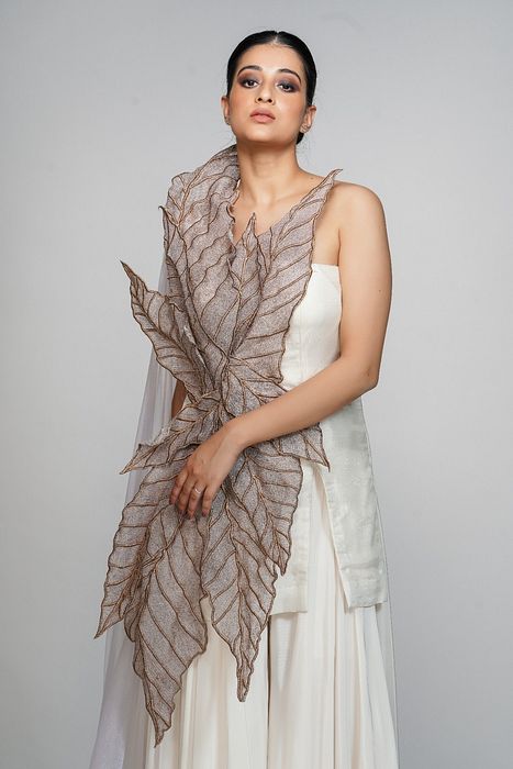 A model showcasing Off White Leaf Sharara Suit by Shruti S Label from Shruti S Label's collection