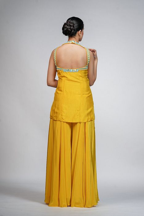 A model showcasing Resham Mirror Work Sharara Set by Shruti S Label from Shruti S Label's collection