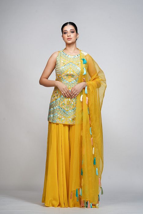 A model showcasing Resham Mirror Work Sharara Set by Shruti S Label from Shruti S Label's collection