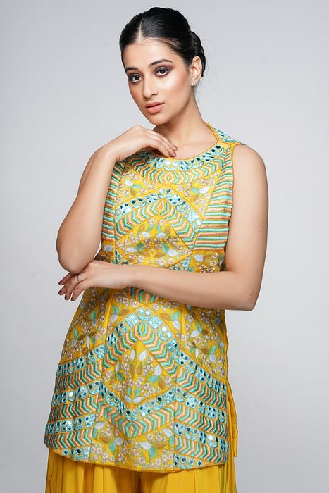 A model showcasing Resham Mirror Work Sharara Set by Shruti S Label from Shruti S Label's collection
