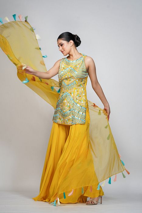 A model showcasing Resham Mirror Work Sharara Set by Shruti S Label from Shruti S Label's collection