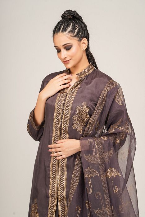 A model showcasing Metallic Print Sharara With Long Shirt by Shruti S Label from Shruti S Label's collection