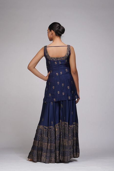 A model showcasing Metallic Print Navy Blue Sharara Suit by Shruti S Label from Shruti S Label's collection