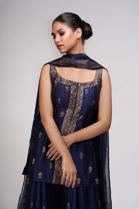 A model showcasing Metallic Print Navy Blue Sharara Suit by Shruti S Label from Shruti S Label's collection