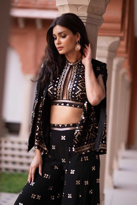 A model showcasing Diana Penty In Jiya Coord Set With Blazer In Black by Gopi Vaid from Gopi Vaid's collection