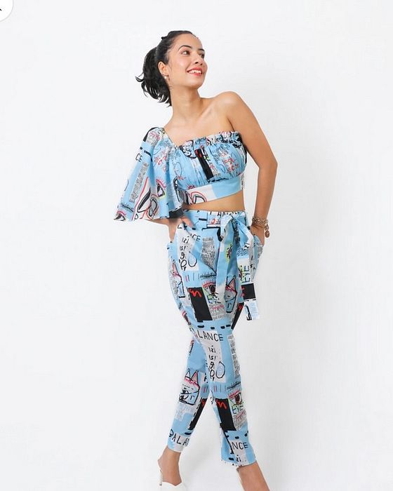 A model showcasing Blue Balance Flutter Coord Set by Fuga Clothing from Fuga Clothing's collection A model showcasing Blue Balance Flutter Coord Set by Fuga Clothing from Fuga Clothing's collection