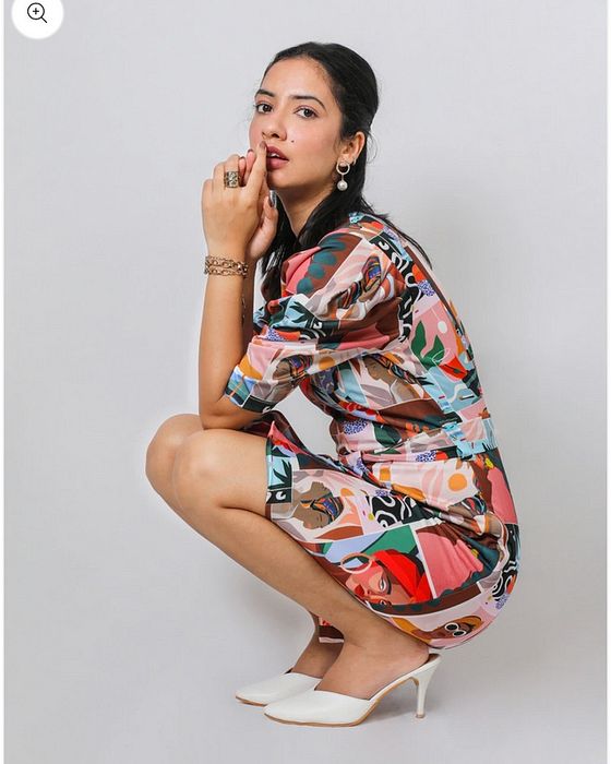 A model showcasing Fuga Pop Sheath Dress by Fuga Clothing from Fuga Clothing's collection A model showcasing Fuga Pop Sheath Dress by Fuga Clothing from Fuga Clothing's collection