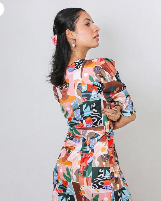 A model showcasing Fuga Pop Sheath Dress by Fuga Clothing from Fuga Clothing's collection A model showcasing Fuga Pop Sheath Dress by Fuga Clothing from Fuga Clothing's collection