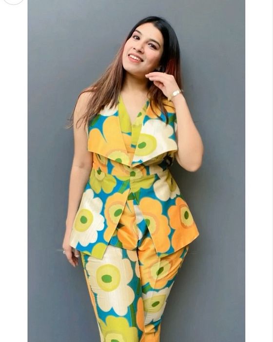 A model showcasing Green Flora Silk Set by Fuga Clothing from Fuga Clothing's collection A model showcasing Green Flora Silk Set by Fuga Clothing from Fuga Clothing's collection