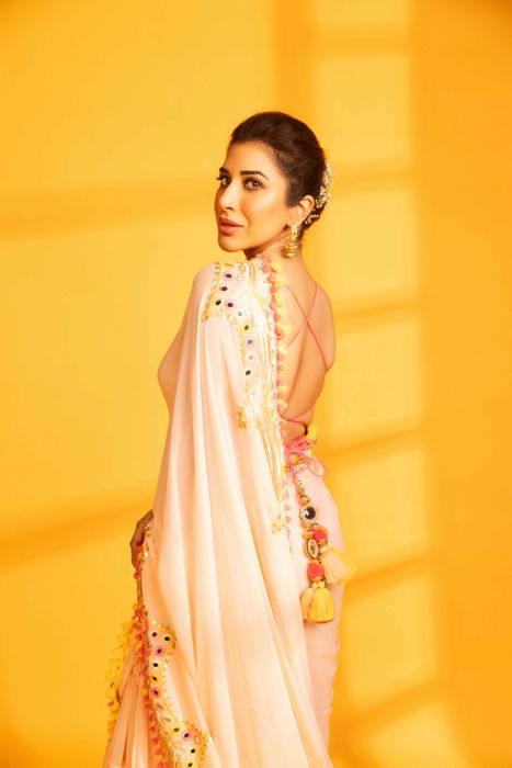 A model showcasing Sophie In Pink Deehar Saree by Gopi Vaid from Gopi Vaid's collection