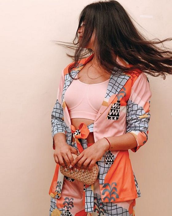 A model showcasing Pine Pop Blazer Coord Set by Fuga Clothing from Fuga Clothing's collection A model showcasing Pine Pop Blazer Coord Set by Fuga Clothing from Fuga Clothing's collection