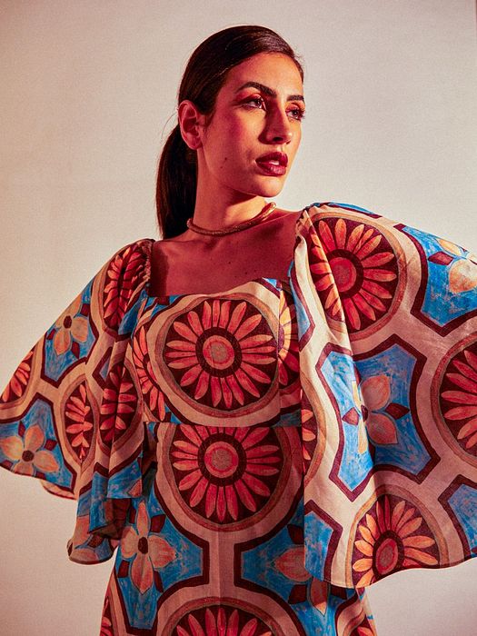 A model showcasing Sunflower Dress by Fuga Clothing from Fuga Clothing's collection A model showcasing Sunflower Dress by Fuga Clothing from Fuga Clothing's collection