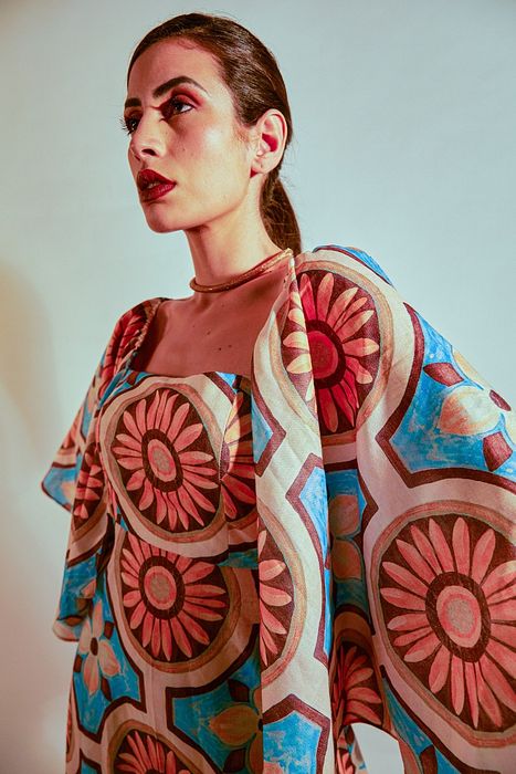 A model showcasing Sunflower Dress by Fuga Clothing from Fuga Clothing's collection A model showcasing Sunflower Dress by Fuga Clothing from Fuga Clothing's collection