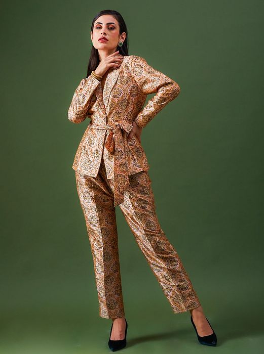 A model showcasing Taupe Coord Set by Fuga Clothing from Fuga Clothing's collection A model showcasing Taupe Coord Set by Fuga Clothing from Fuga Clothing's collection