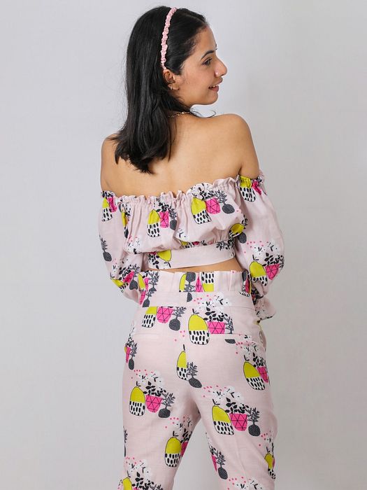 A model showcasing Tropical Flounce Set by Fuga Clothing from Fuga Clothing's collection A model showcasing Tropical Flounce Set by Fuga Clothing from Fuga Clothing's collection
