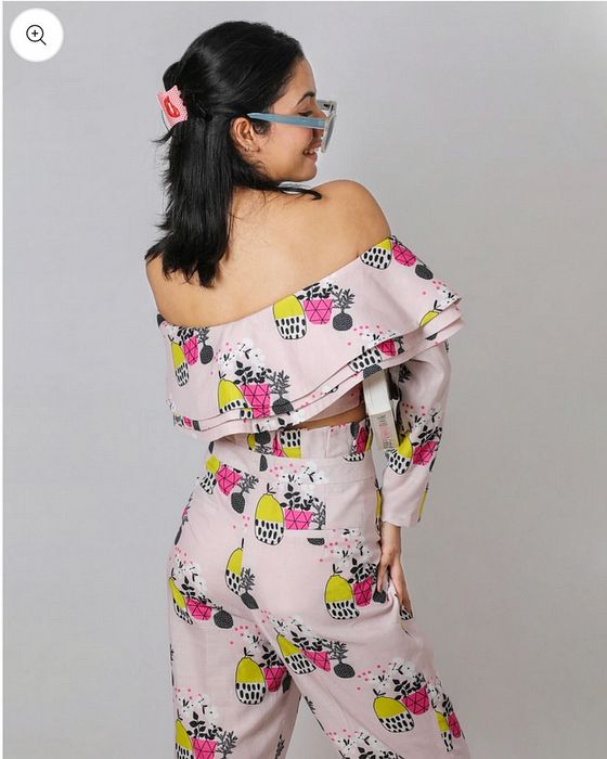 A model showcasing Tropical Vase Coord Set by Fuga Clothing from Fuga Clothing's collection A model showcasing Tropical Vase Coord Set by Fuga Clothing from Fuga Clothing's collection