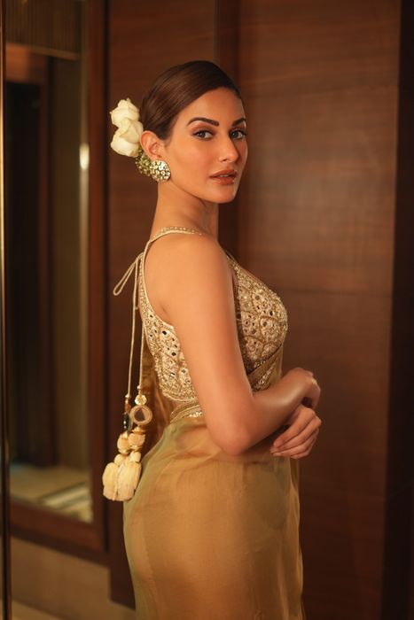 A model showcasing Amyra Dastuur Beige Saree Set by Gopi Vaid from Gopi Vaid's collection