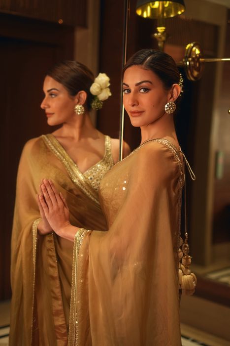 A model showcasing Amyra Dastuur Beige Saree Set by Gopi Vaid from Gopi Vaid's collection