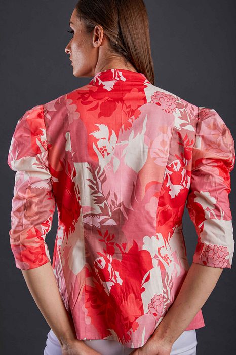 A model showcasing Blush And Rose Blazer by Fuga Clothing from Fuga Clothing's collection A model showcasing Blush And Rose Blazer by Fuga Clothing from Fuga Clothing's collection