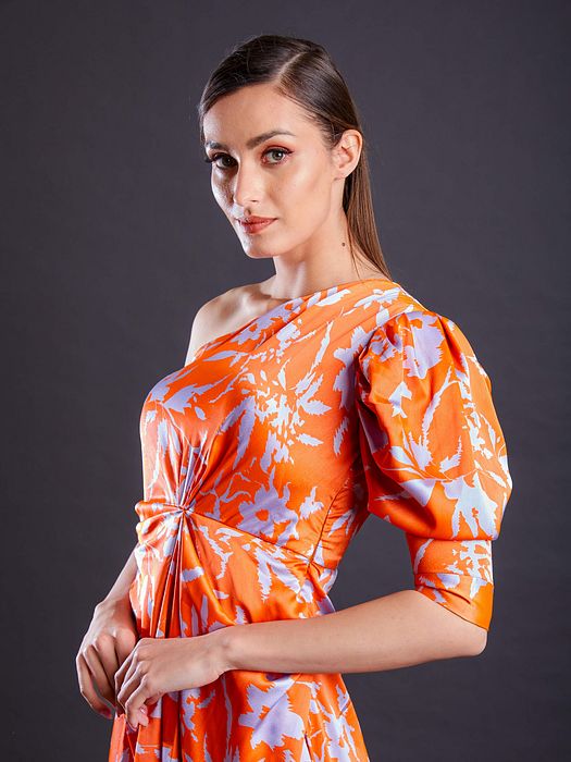 A model showcasing Tangerine Dress by Fuga Clothing from Fuga Clothing's collection A model showcasing Tangerine Dress by Fuga Clothing from Fuga Clothing's collection