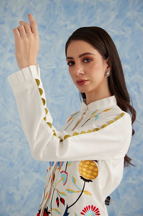A model showcasing White Linen Pine Set by Fuga Clothing from Fuga Clothing's collection A model showcasing White Linen Pine Set by Fuga Clothing from Fuga Clothing's collection
