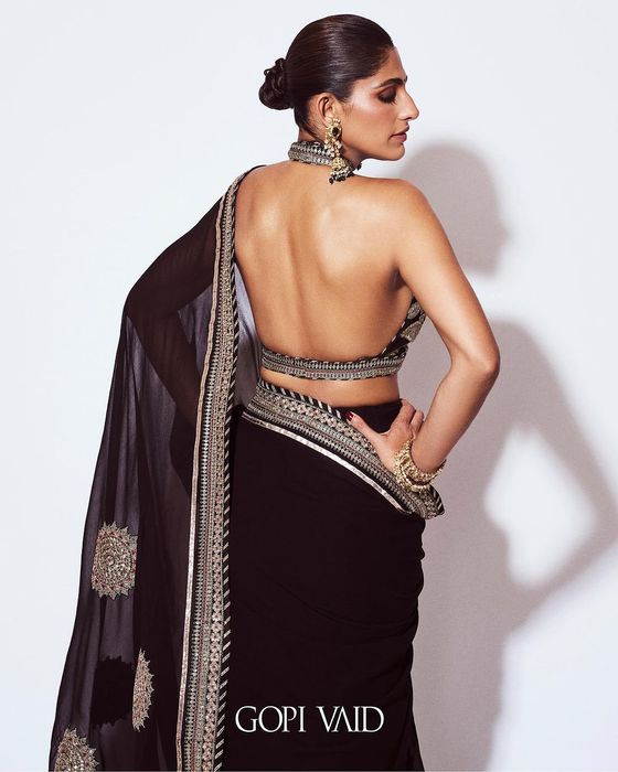 A model showcasing Kubbra Sait And Akanksha Malhotra In Black Golconda Anupa Saree Set by Gopi Vaid from Gopi Vaid's collection