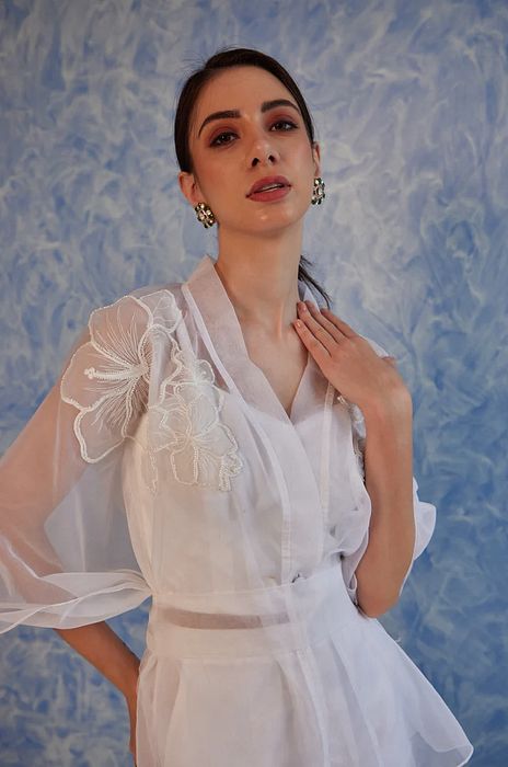 A model showcasing White Sheer Set by Fuga Clothing from Fuga Clothing's collection A model showcasing White Sheer Set by Fuga Clothing from Fuga Clothing's collection