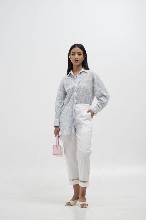 A model showcasing Mia Quirky Embroidery Shirt by Stitch Stories from Stitch Stories's collection